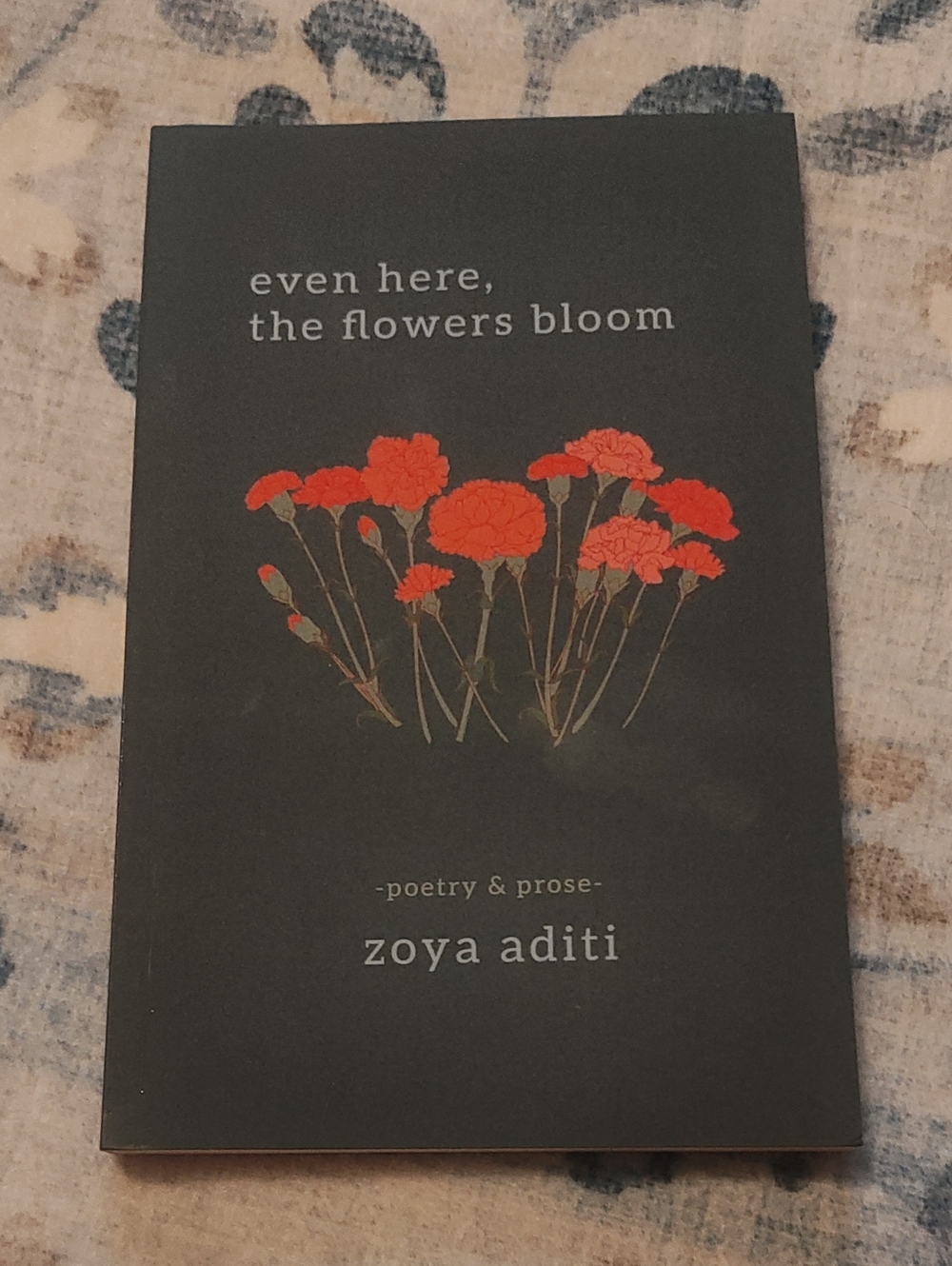 POEMS: EVEN HERE, THE FLOWERS BLOOM